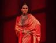 Malaika Arora wooing us in orange-red sari by Raw Mango 