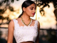 Kannada Actress Nishvika Naidu Glowing In Crop white Top With Stunning Pearl Necklace