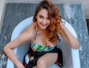 Actress Ragini Dwivedi's Striking Photos In A Floral One-Piece Bikini !