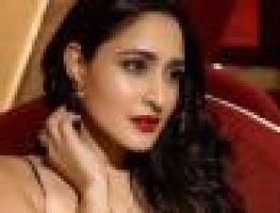 Achari America Yatra Movie Actress Pragya Jaiswal's Striking Poses In A Black Mini Dress