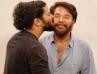 Dulquer Cuts Birthday Cake; Mammootty With .The Camera Behind Him.